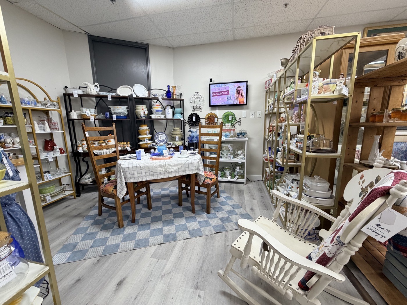 An antique mall booth with vintage kitchenware, glassware and a set dining table, Marissa's Home at The Crush Warehouse in Plano, Texas